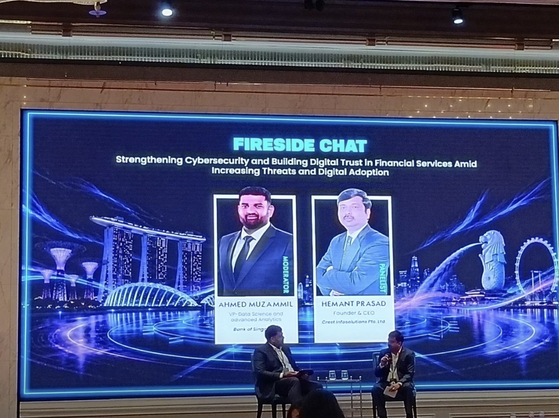 Ahmed Muzammil moderating a fireside chat in Singapore