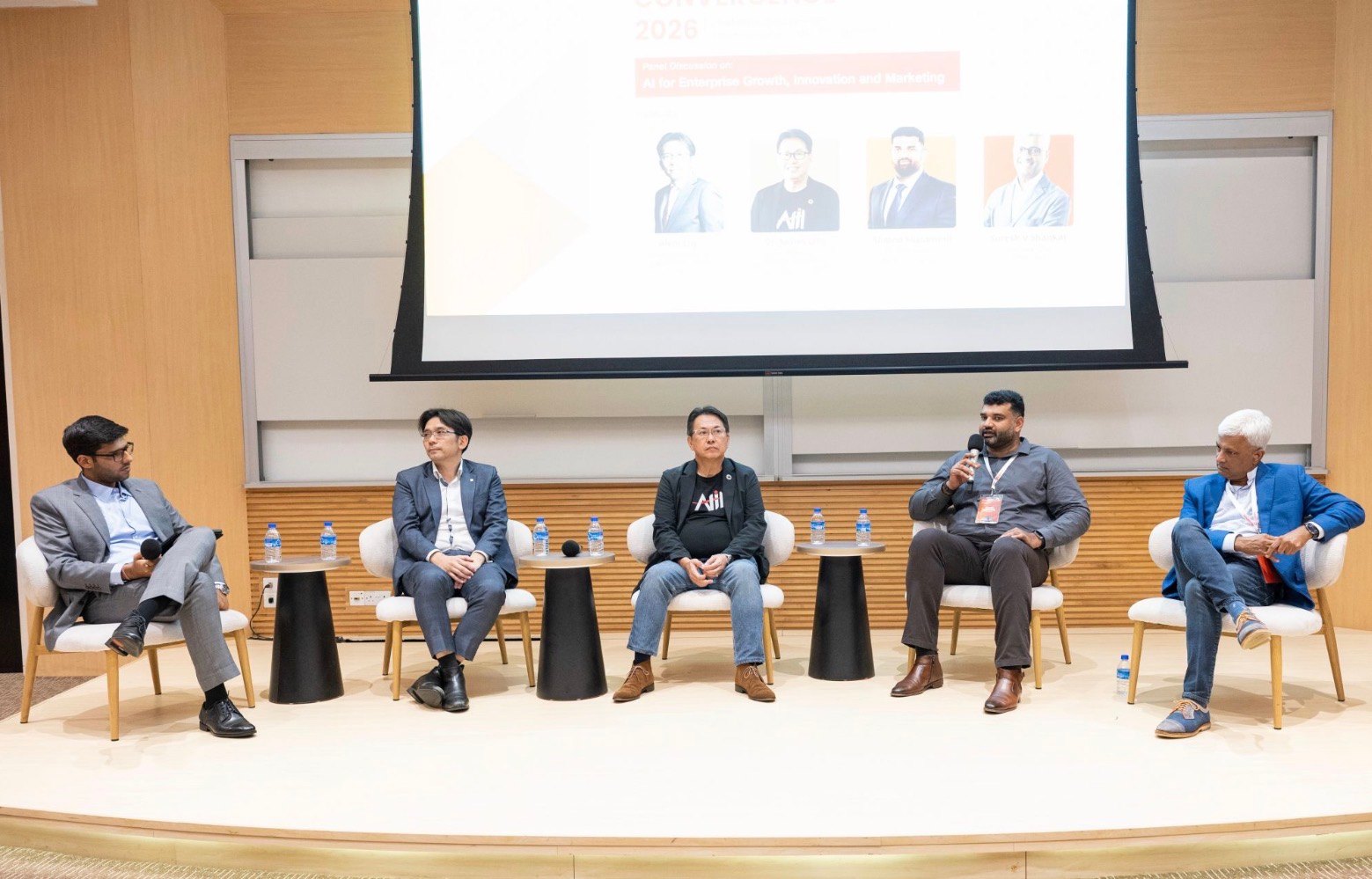 Ahmed Muzammil speaking on a five-person panel at Jio Institute Convergence 2026